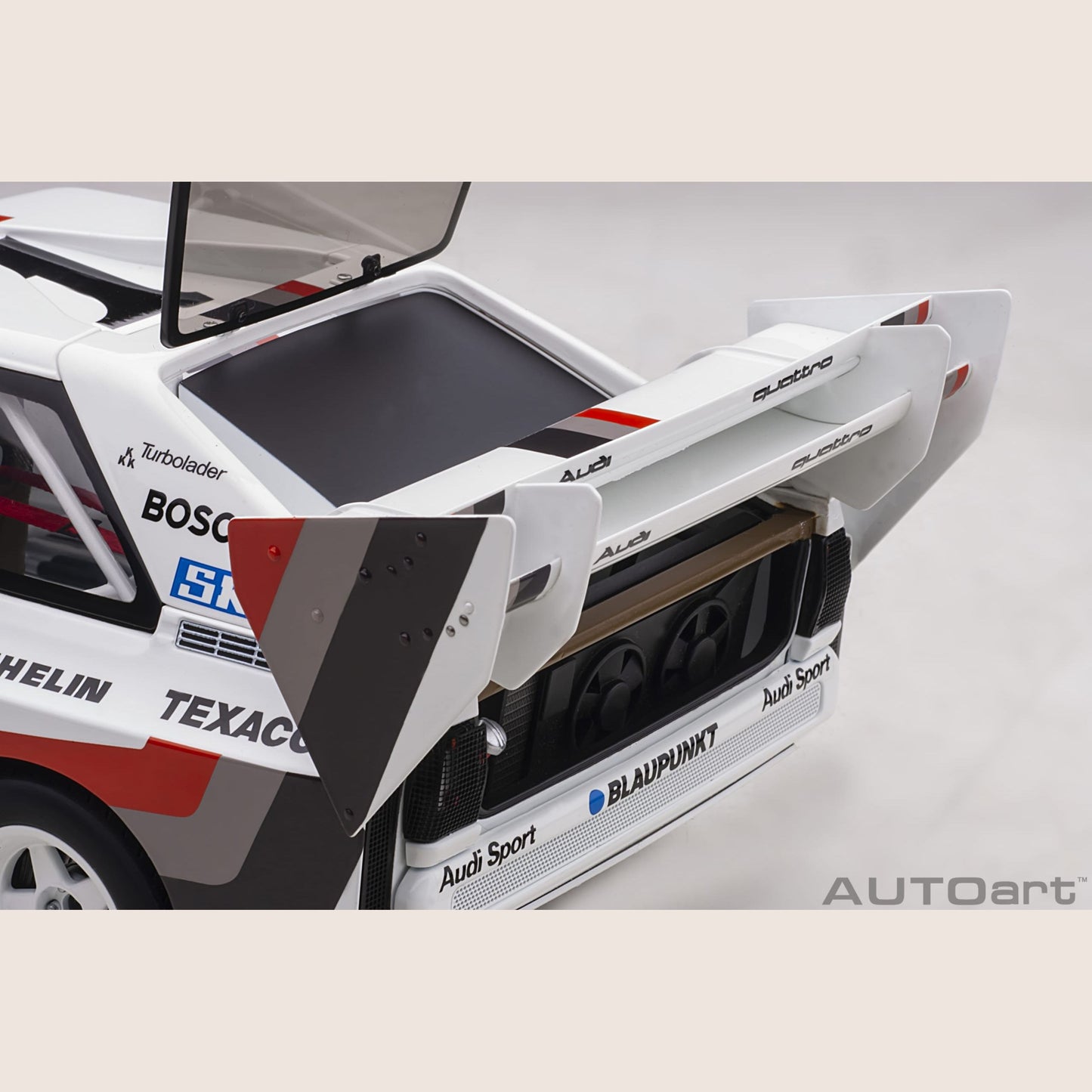 Audi Sport Quattro - Miniature model of the Audi Sport Quattro, a legendary rally car with a powerful engine.