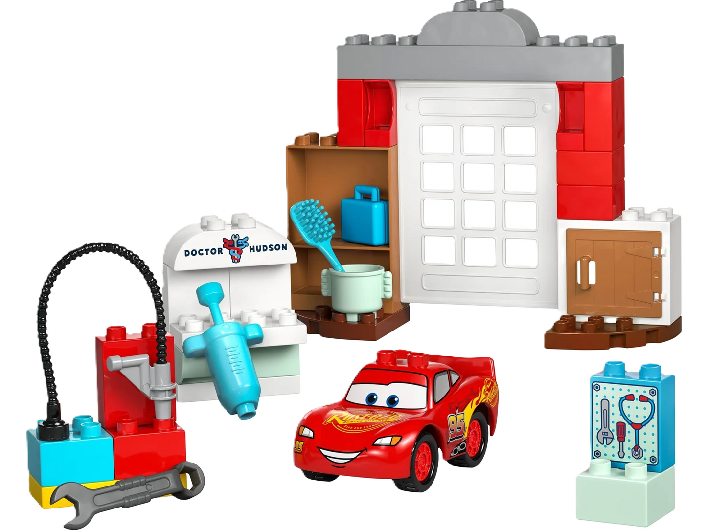 Lego Duplo "Lightning McQueen visits Doc's workshop" - colorful Duplo set with Lightning McQueen and Doc Hudson in their workshop. Perfect for little car enthusiasts and creative play.