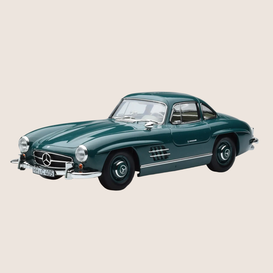 Detailed 1:18 scale model car of the classic 1954 Mercedes-Benz 300 SL. Manufactured by Norev with authentic design and iconic gullwing doors.