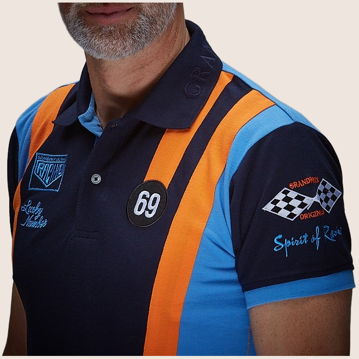 69 Racing Team Polo Navy - Classic navy polo shirt with 69 Racing Team design. Motorsport-inspired style with embroidered details, perfect for vintage racing enthusiasts.