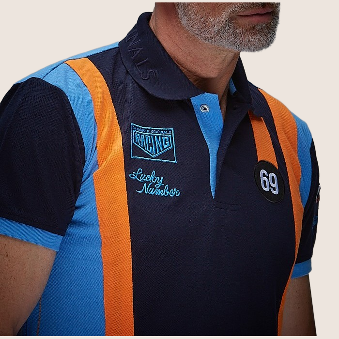 69 Racing Team Polo Navy - Classic navy polo shirt with 69 Racing Team design. Motorsport-inspired style with embroidered details, perfect for vintage racing enthusiasts.