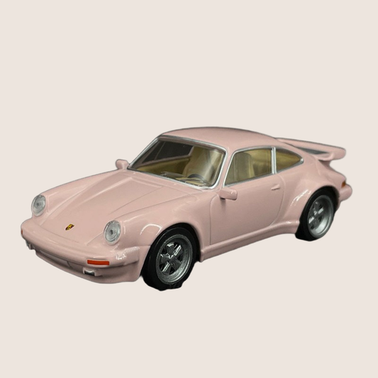 Porsche 911 Turbo Pink 1:43 Norev - Detailed 1:43 scale model of the Porsche 911 Turbo in eye-catching pink. Manufactured by Norev with precise lines and authentic design. A unique addition to any car collection