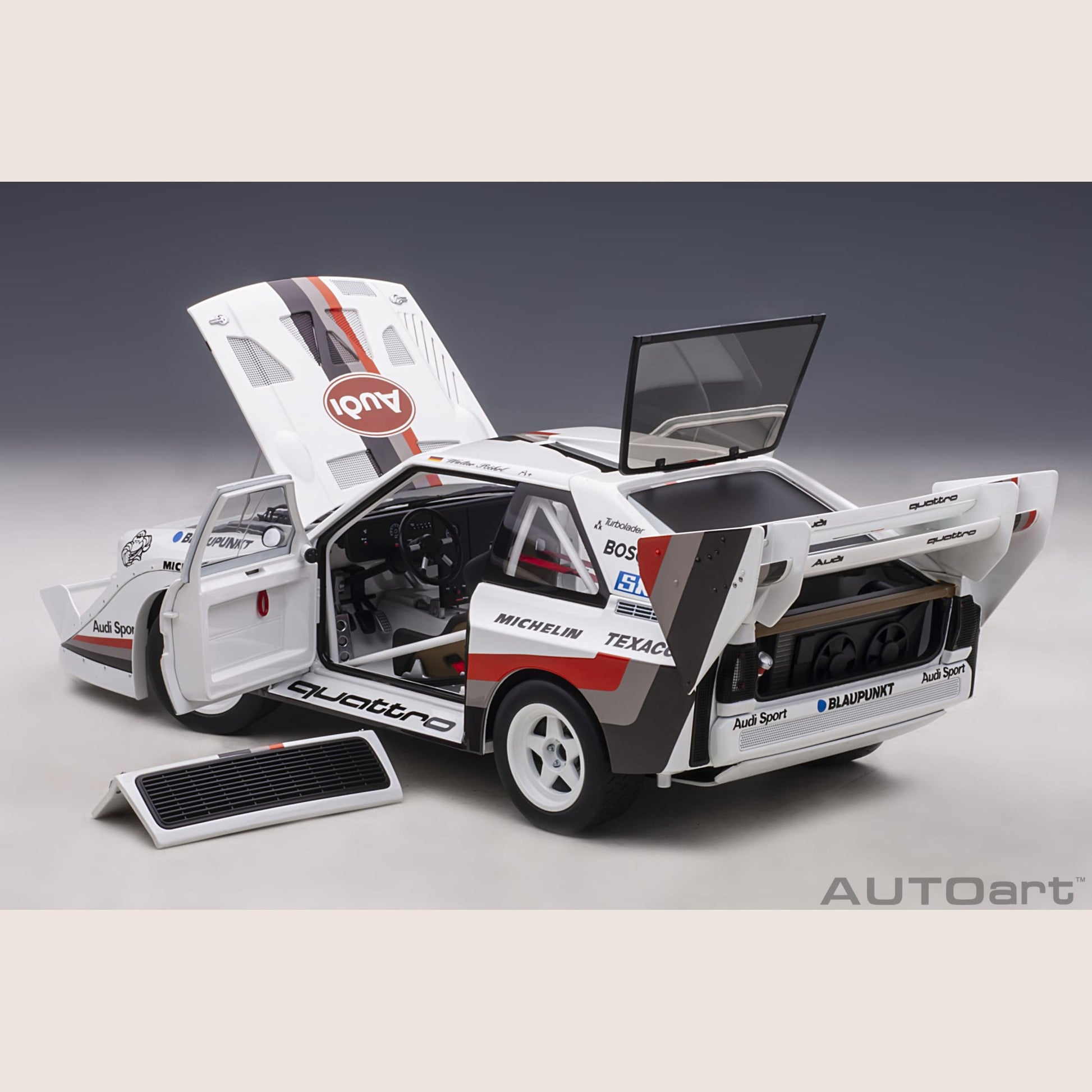 Audi Sport Quattro - Miniature model of the Audi Sport Quattro, a legendary rally car with a powerful engine.
