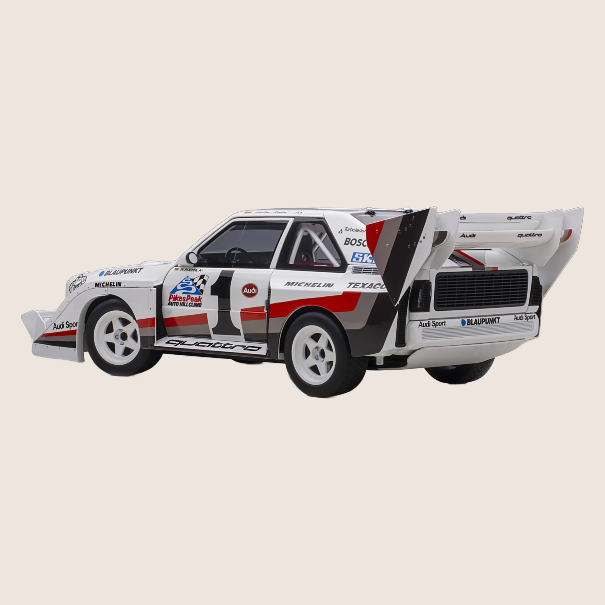 Audi Sport Quattro - Miniature model of the Audi Sport Quattro, a legendary rally car with a powerful engine.