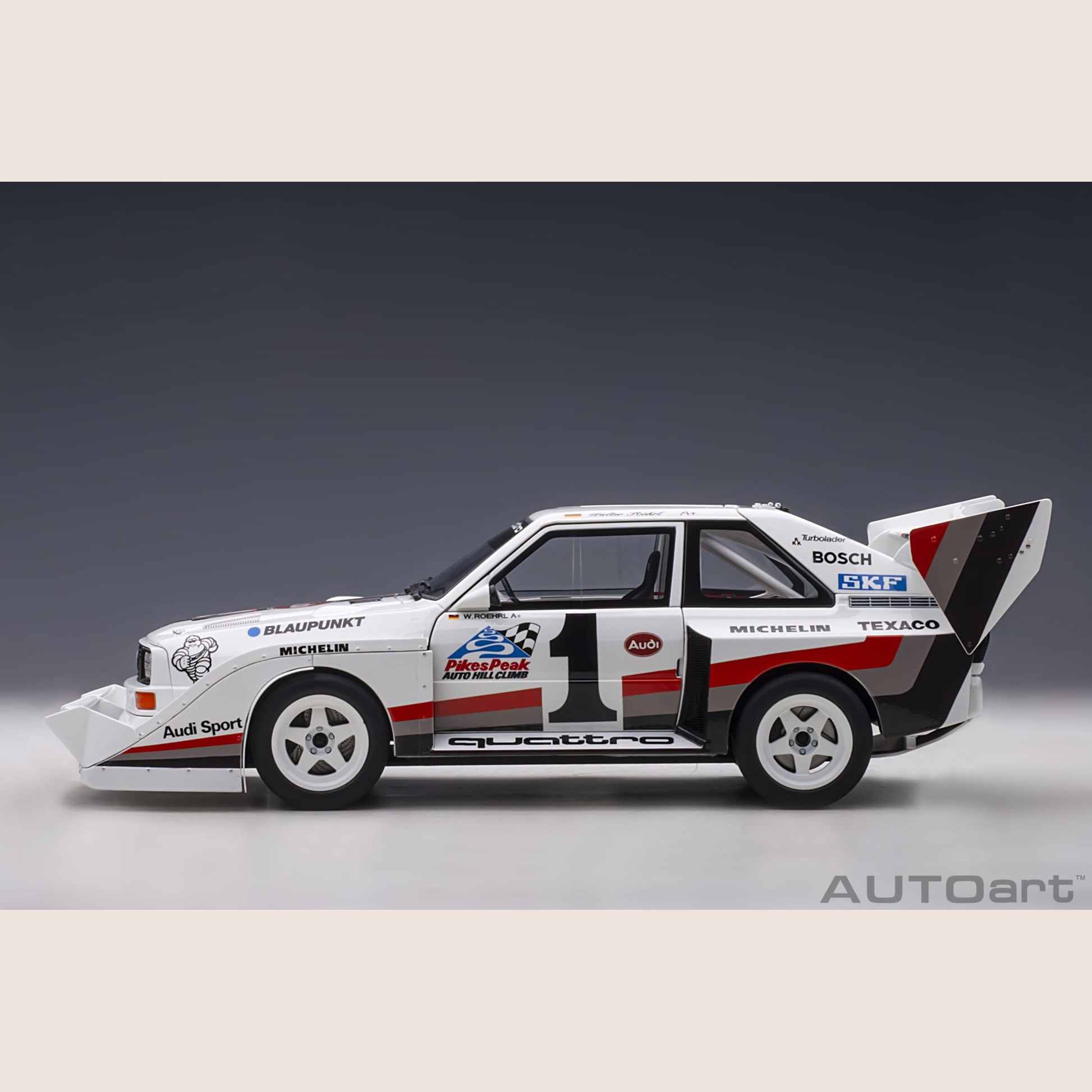 Audi Sport Quattro - Miniature model of the Audi Sport Quattro, a legendary rally car with a powerful engine.