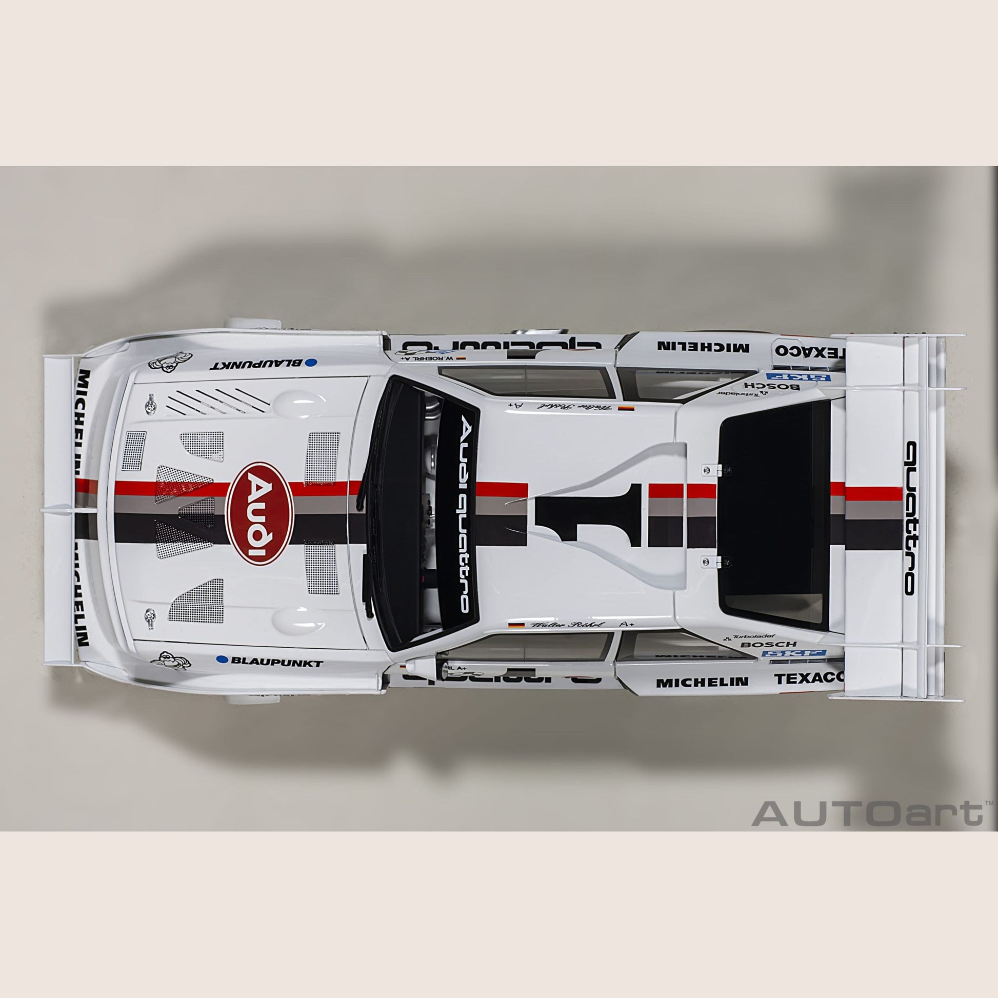 Audi Sport Quattro - Miniature model of the Audi Sport Quattro, a legendary rally car with a powerful engine.