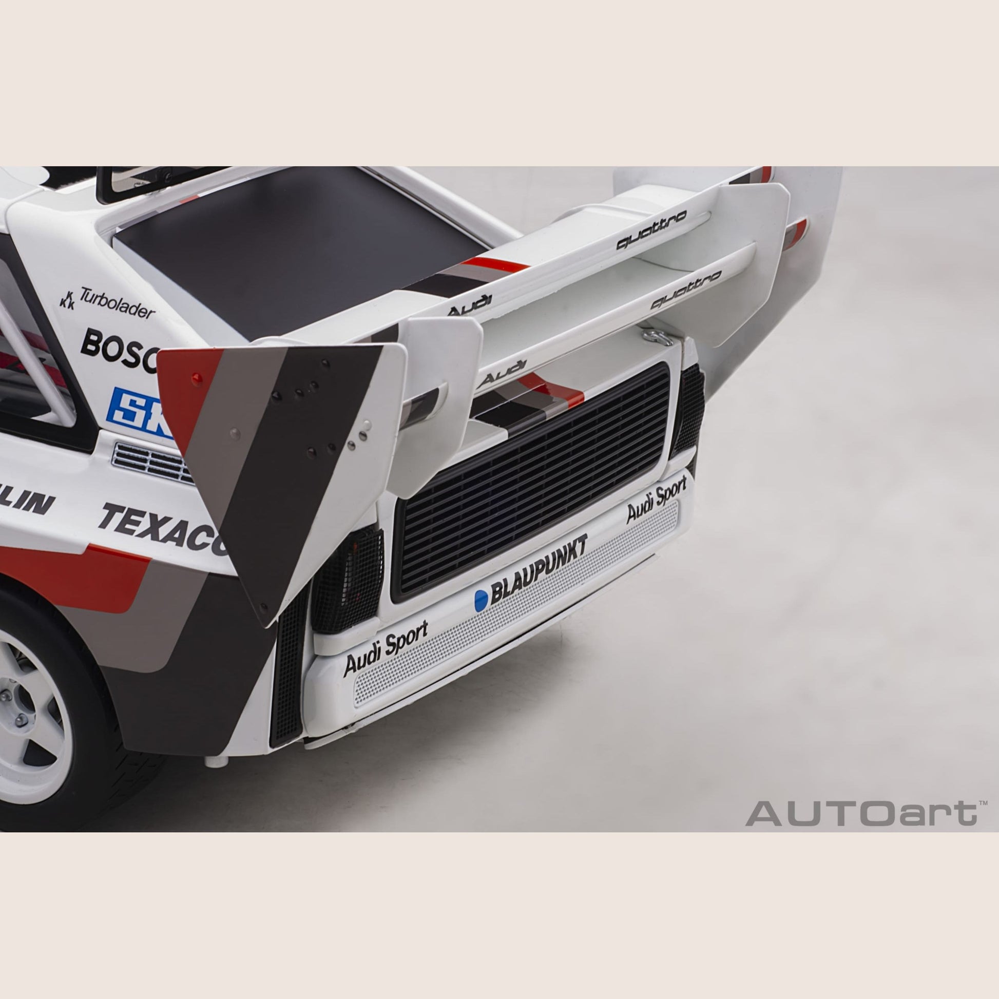 Audi Sport Quattro - Miniature model of the Audi Sport Quattro, a legendary rally car with a powerful engine.