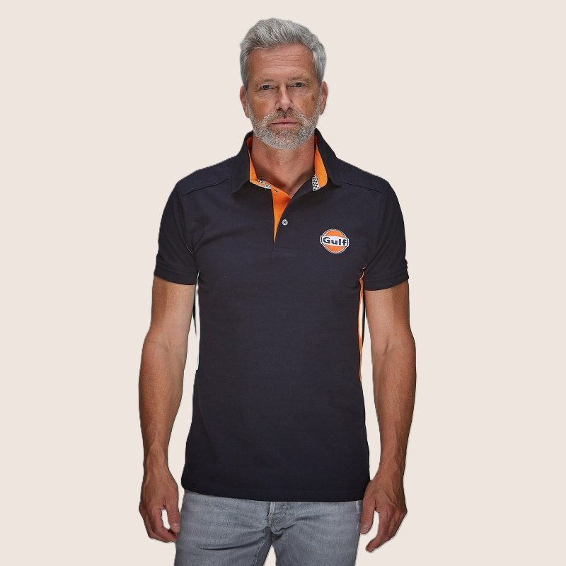 Gulf Side Stripe Polo Navy - Sporty polo in navy blue with iconic Gulf racing stripes along the side. Comfortable cotton design, perfect for motorsport fans and everyday wear.