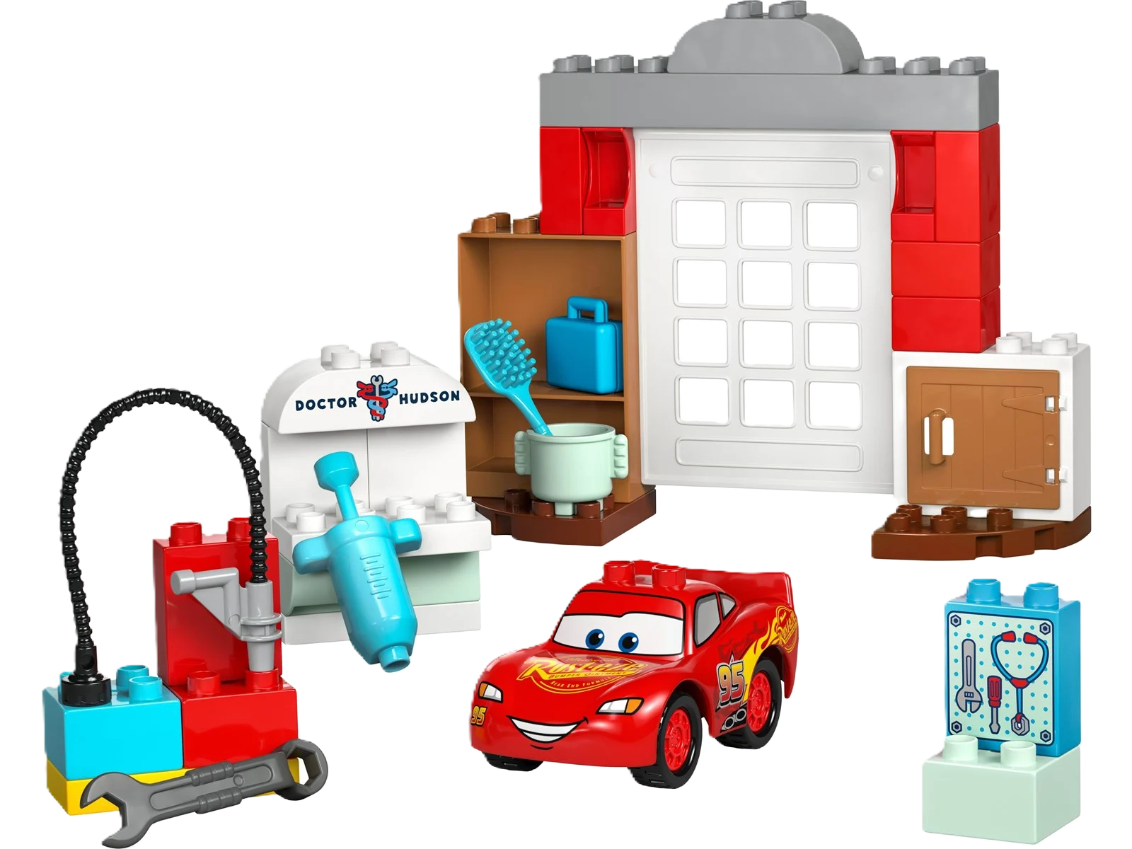 Lego Duplo "Lightning McQueen visits Doc's workshop" - colorful Duplo set with Lightning McQueen and Doc Hudson in their workshop. Perfect for little car enthusiasts and creative play.
