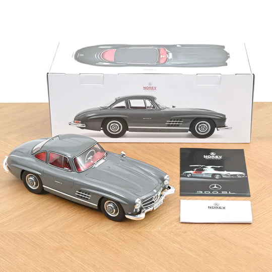 Mercedes-Benz 300 SL 1:12 scale model in graphite gray from Norev with gullwing doors and detailed design