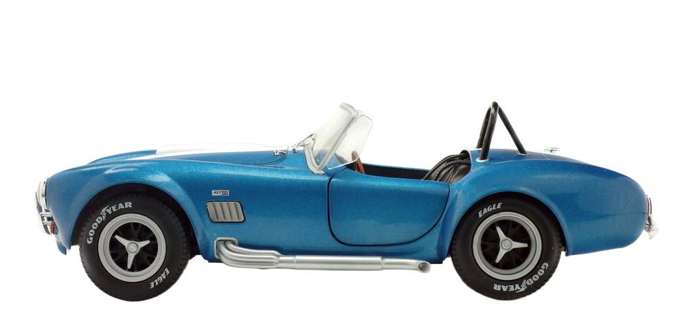 Solido Shelby Cobra 427 MKII 1965 1:18 - Detailed diecast model of the classic 1965 Shelby Cobra 427 MKII in 1:18 scale. Made of metal, with open doors, adjustable front wheels, side mirrors and authentic design - ideal for car enthusiasts and collectors.