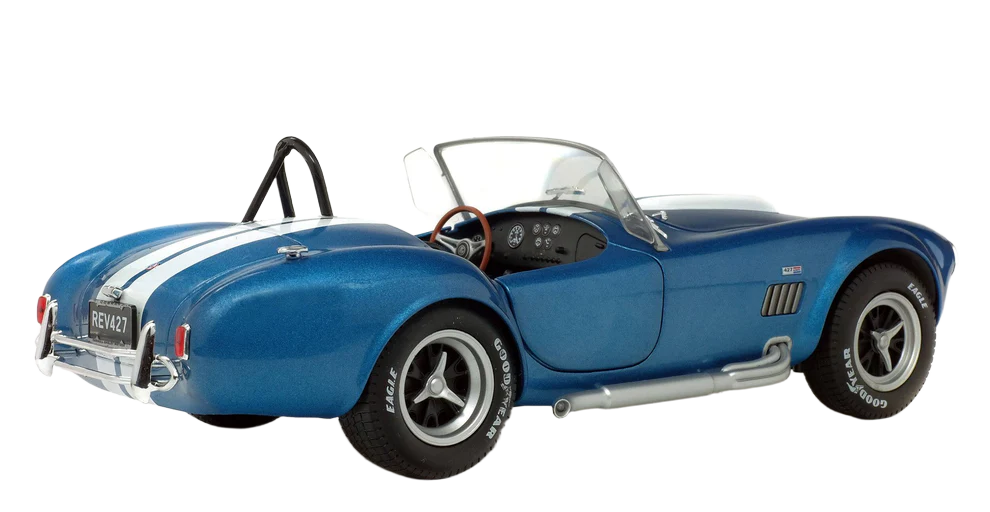 Solido Shelby Cobra 427 MKII 1965 1:18 - Detailed diecast model of the classic 1965 Shelby Cobra 427 MKII in 1:18 scale. Made of metal, with open doors, adjustable front wheels, side mirrors and authentic design - ideal for car enthusiasts and collectors.