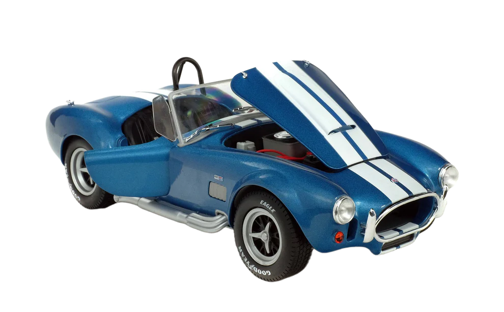 Solido Shelby Cobra 427 MKII 1965 1:18 - Detailed diecast model of the classic 1965 Shelby Cobra 427 MKII in 1:18 scale. Made of metal, with open doors, adjustable front wheels, side mirrors and authentic design - ideal for car enthusiasts and collectors.